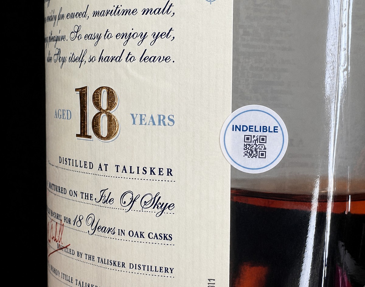 A secure Indelible label with QR verification applied to a premium spirits bottle.